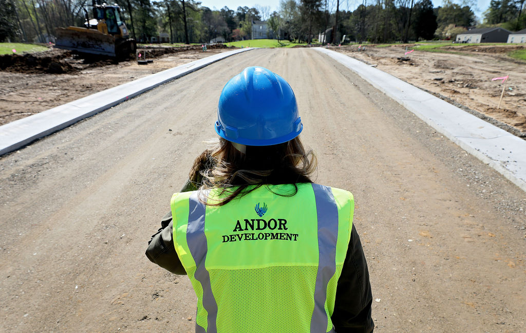 Andor Development’s Angela Healy walks down one of the streets in the new Main Street Landing development off of Main Street near Gloucester Thursday April 2, 2020
