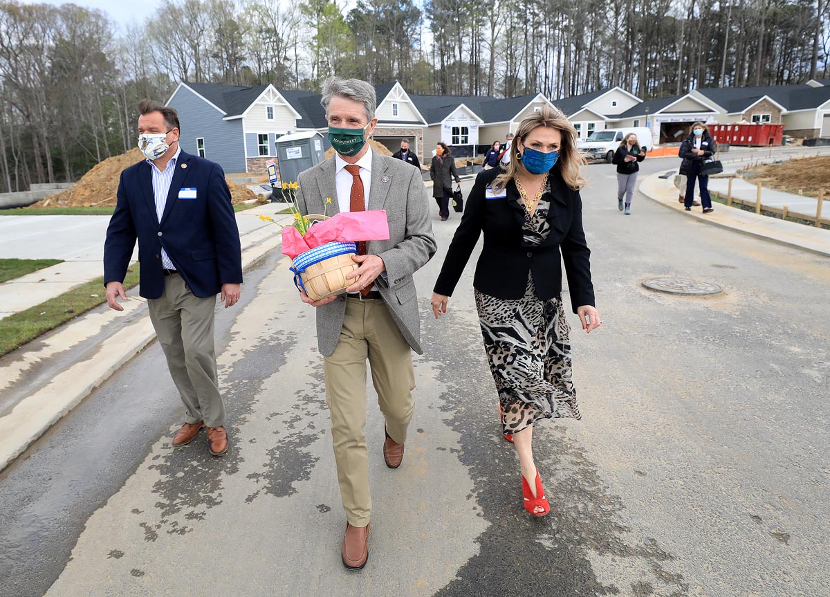 Andor Development’s Angela Healy walks with Congressman Rob Wittman and Delegate Keith Hodges through the Main Street Landing development in Gloucester Thursday April 1, 2021.